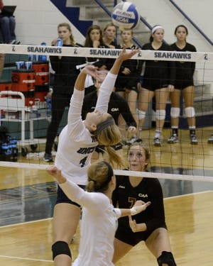 UNCW (in white) defeated College of Charleston in a CAA volleyball match on Wednesday, Oct. 15, 2014.