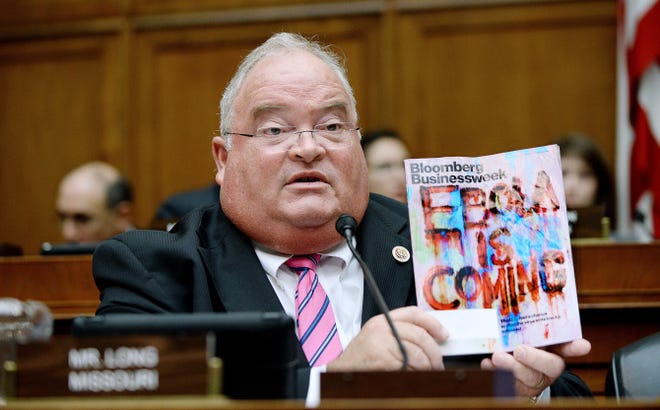 Rep. Billy Long, R-Mo., displays a magazine cover on Ebola during a House Energy and Commerce Committee Oversight and Investigations Subcommittee hearing on 'Examining the US Public Health Response to the Ebola Outbreak' in Washington on Thursday.