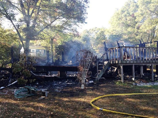 A photograph taken Friday morning shows that little is left of the home on Prudence Island after the fatal fire Thursday night.