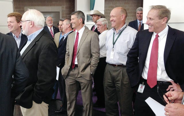 TIMES RECORD FILE PHOTO  /  Officials gather May 30, 2014, at the Fort Smith Convention Center for an announcement that ArcBest will build a new corporate headquarters at Chaffee Crossing and make a $30 million investment that will create 975 new jobs in the region.