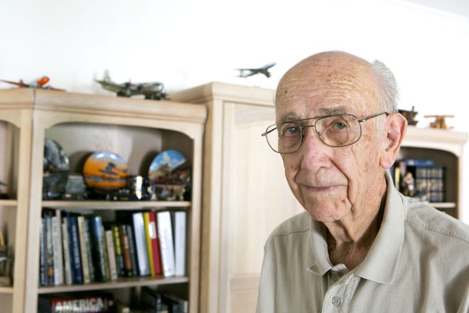 John Grimshaw was a Pan Am flight engineer who flew military air transport during World War II and later crewed commercial jet air liners. He is shown in the office of his Ocala, Florida home on Monday, October 6.