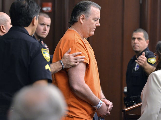 Michael Dunn is taken out of the courtroom after sentencing.