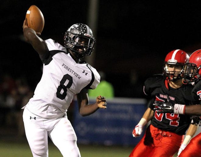 Forestview quarterback John Crawford throws a pass during their game against South Point Friday night.