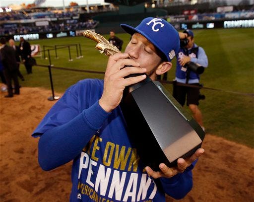 Kansas City Royals' James Shields kisses the trophy after the Royals defeated the Baltimore Orioles to win the American League championship series on Wednesday and advanced to the World Series for the first time since 1985. AP photo