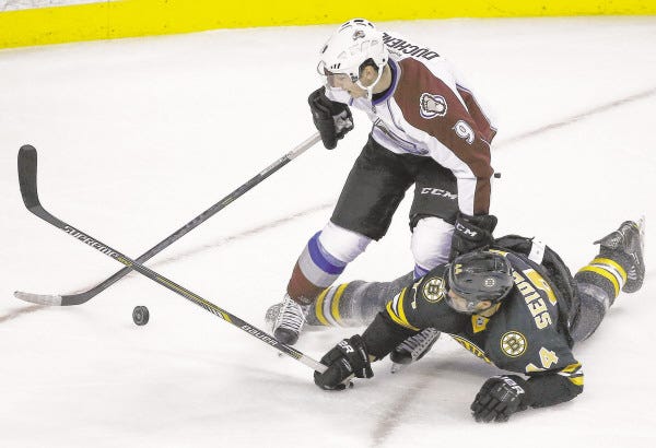 AP
Dennis Seidenberg hits the ice after a collision Monday vs. Colorado.
