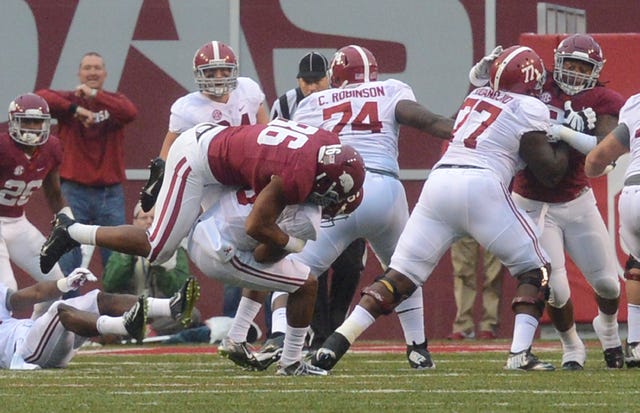 BRIAN D. SANDERFORD • TIMES RECORD University of Arkansas’ Trey Flowers sacks Alabama quarterback Blake Sims on Saturday, Oct. 11, 2014 in Fayetteville. 
 BRIAN D. SANDERFORD • TIMES RECORD Alabama quarterback Blake Sims, center, is stopped by Arkansas on a fourth down and inches during the fourth quarter on Saturday, Oct. 11, 2014 in Fayetteville.