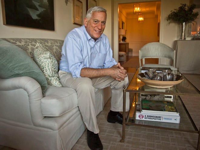 Author Walter Isaacson poses before an interview at his home in New York. Isaacson's new book, “The Innovators,” offers history of digital age.