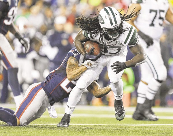 New England Patriots strong safety Patrick Chung, left, tackles New York Jets running back Chris Ivory during the first half of an NFL football game Thursday, Oct. 16, 2014, in Foxborough, Mass. (AP Photo/Charles Krupa) ORG XMIT: FBO114
New England Patriots strong safety Patrick Chung, left, tackles New York Jets running back Chris Ivory during the first half of an NFL football game Thursday, Oct. 16, 2014, in Foxborough, Mass. (AP Photo/Charles Krupa) ORG XMIT: FBO114