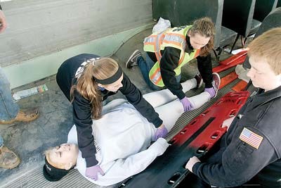 Photo by David Burns Members of the Wantage Township First Aid Squad participate in a multi-casualty incident simulation on Sunday behind the Beemerville Fire Department on Route 519.