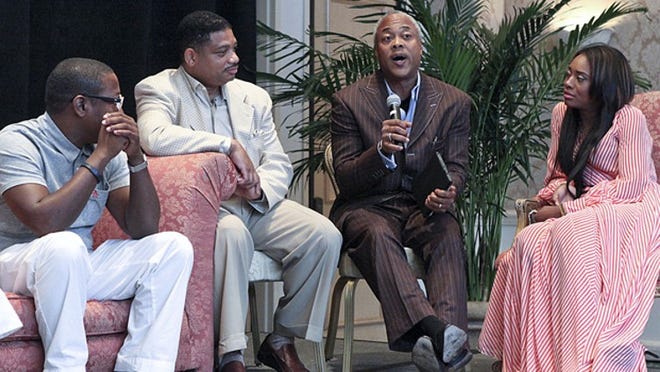 (l-r) Marc Byers, CEO of Rockstar Entertainment, Everett Hall, fashion designer, Bernard Bronner, President & CEO of Bronner Bros., and Yandy Smith, reality show personality and entrepreneur, participate in a panel discussion July 25, 2013 at the Four Seasons during a National Black Chamber of Commerce convention. Other panelists included NBA reporter Niesha Butler, Blueprint, Inc. founder Ky Dele, and Miami Marlins General Counsel Derek Jackson. (Damon Higgins/The Palm Beach Post)