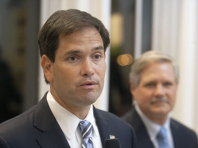 Sen. Marco Rubio, R-Fla., addresses a Republican fundraiser as Sen. John Hoeven, R-N.D., right, looks on, Tuesday, Oct. 14 in Fargo, N.D. North Dakota Republicans said Florida Sen. Marco Rubio's appearance at a fundraiser Tuesday night should encourage party faithful to finish off what they expect to be a successful election.