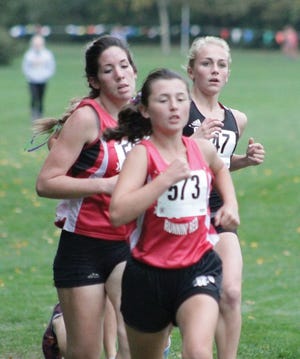 Metamora girls leader Cassy Fitzgibbons leads a pack of runners at the Mid-Illini Conference cross country meet Friday.