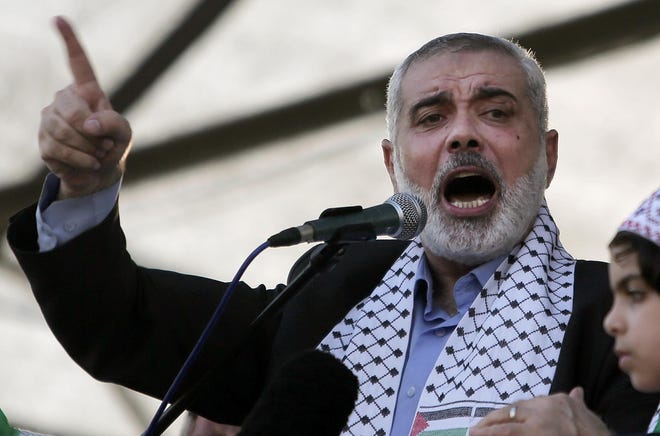 FILE - In this Wednesday, Aug. 27, 2014 file photo, Palestinian top Hamas leader in Gaza, Ismail Haniyeh, gives a speech during a rally in Gaza City. Israel and the Gaza Strip are bound by much more than enmity: Israel controls nearly everything that comes in and out of the territory, including food and energy, and sometimes allows Gazans to enter the country for medical care. But following a bloody 50-day war over the summer, a decision to allow the young daughter of a top Hamas official to receive care at an Israeli hospital is proving to be too much for some Israelis. The treatment of Ismail Haniyeh's daughter in October, 2014 has sparked a debate over whether Israel's stated commitment to providing humanitarian aid should be extended to its bitterest enemies. (AP Photo/Khalil Hamra, File)