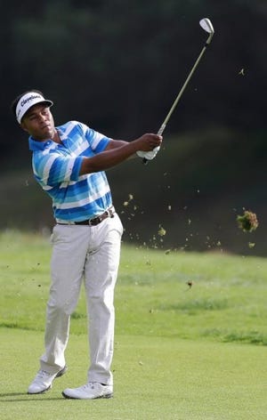 Harold Varner III, seen here in the Northern Trust Open earlier this year, will have his golf shirt honored at Forestview High School.