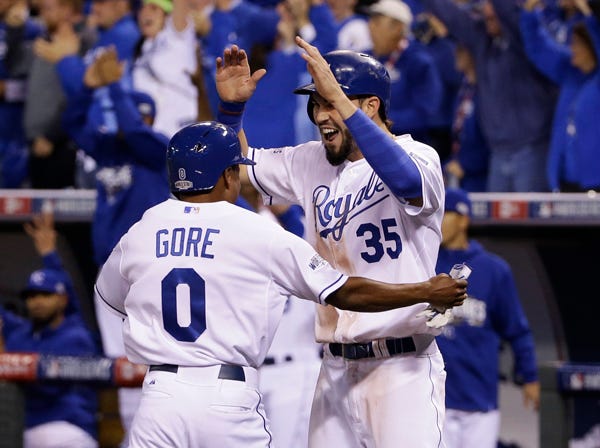 Kansas City's Terrance Gore celebrates with teammate Eric Hosmer after scoring on an RBI double by Salvador Perez during the sixth inning of Game 2 of the World Series against the San Francisco Giants on Wednesday in Kansas City, Mo. (Matt Slocum | Associated Press)