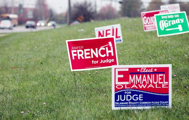 This Oct. 21 photo shows political campaign signs near a state highway in Westerville, Ohio. Signs touting local and statewide candidates are in full bloom along highways, street corners and public rights of way. Enter the Columbus Sign Ninjas, a group that sprang up to take down campaign clutter from public spaces. AP PHOTO/COLUMBUS DISPATCH/FRED SQUILLANTE