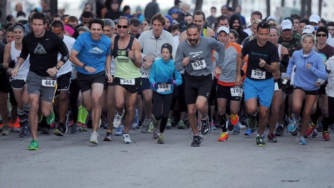 Competitors begin the 2013 Town of Palm Beach United Way Turkey Trot on Sunset Avenue. Registration is now open for this year’s event.