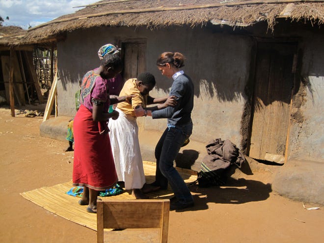 Dr. Casey Nesbit, assistant professor and director of clinical education at University of the Pacific, works with patients in rural Malawi. COURTESY PHOTO