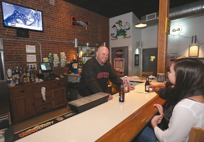 Krocker's Bar and Grill owner Mark Krocker with customers Friday afternoon.