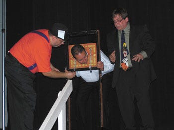 Despite being handcuffed, Magician Mark Joseph managed to escape from a headlock during Saturday's benefit magic show at Colon Elementary. The hour-long program was staged to help the Colon Food Pantry.