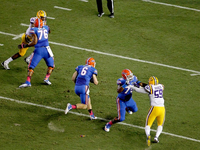 Florida quarterback Jeff Driskel runs up field against LSU during the first half at Ben Hill Griffin Stadium on Oct. 11. LSU defeated Florida 30-27.