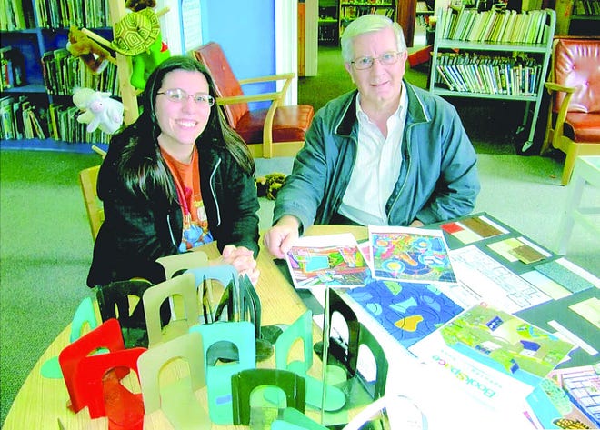 Kenneth B. Shockey (right) reviews drawings and selected furnishings for the new children's section at the Alexander Hamilton Memorial Free Library with Youth Services Coordinator Lori Milach. The Paul K. and Anna E. Shockey Foundation donated $50,000 toward the Bricks.Books.Bytes. capital campaign funding a construction project that nearly doubles the size of the existing facility. This is the library's first expansion since 1988.
