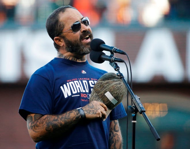 Recording artist Aaron Lewis performs the national anthem before Game 5 of baseball's World Series between the Kansas City Royals and the San Francisco Giants on Oct. 26 in San Francisco.