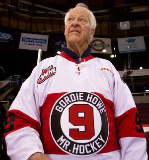 FILE - In this Feb. 2, 2012, file photo, hockey great Gordie Howe, part owner of the Western Hockey League's Vancouver Giants, looks on during a team news conference in Vancouver, British Columbia. Howe's family says the hockey Hall of Famer's condition remains "guarded" but his spirits are good after a significant stoke Sunday. The family released a statement through the Detroit Red Wings on Wednesday, Oct. 29, 2014. (AP Photo/The Canadian Press, Darryl Dyck, File)