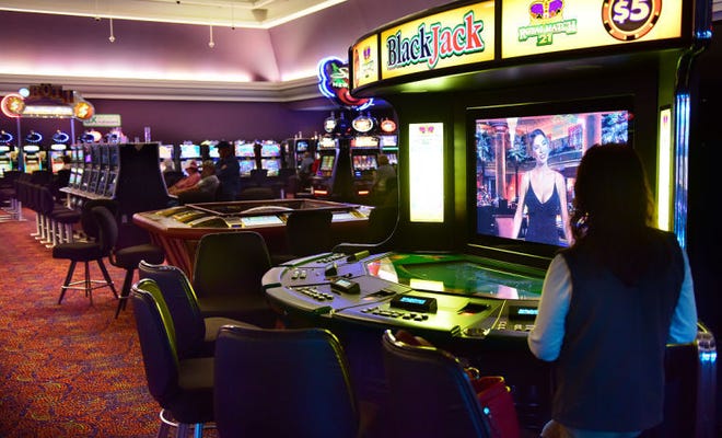 A patron plays at a virtual blackjack terminal on a recent day at Newport Grand. One TripAdvisor reviewer said of the facility: 'Not sure what to say about this place other than it was quite desolate... almost like a scene out of the Walking Dead.'