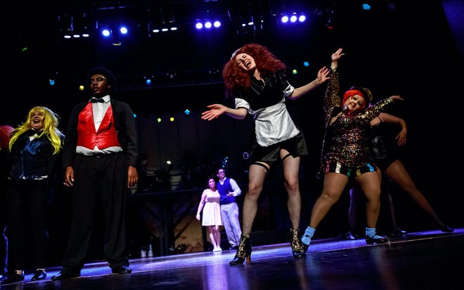 Molly Heise, center, as Magenta, sings one of the opening songs in “The Rocky Horror Show.” The musical opens Thursday at the Hoogland Center for the Arts.