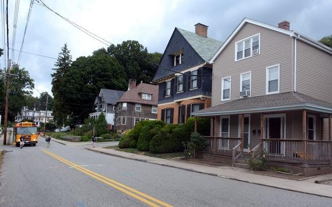 Two sex offenders are living in the home at 152 Broad St. in Norwich, the house on the right, close to where children were getting off the school bus Tuesday. 

Aaron Flaum/ NorwichBulletin.com