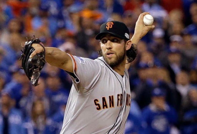 San Francisco Giants pitcher Madison Bumgarner throws during the fifth inning of Game 7 of baseball's World Series against the Kansas City Royals Wednesday, Oct. 29, 2014, in Kansas City, Mo.