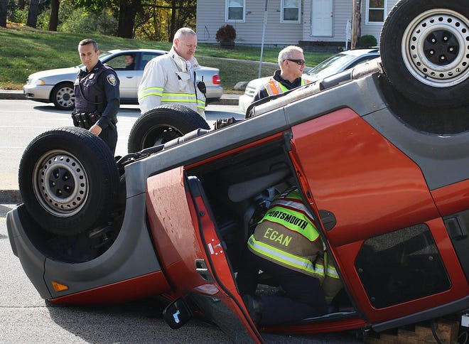 An 18-year-old driver was hospitalized after crashing a Honda into another vehicle, rolling over at least twice, then sliding about 100 feet down Woodbury Avenue, witnesses said.

Photo by Rich Beauchesne/Seacoastonline