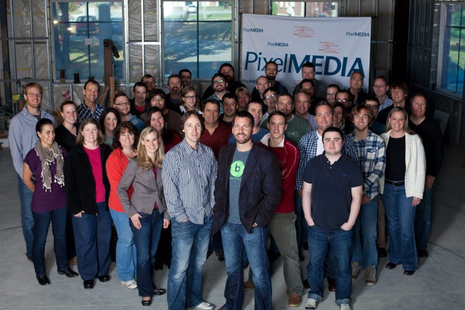 The staff of PixelMedia gathers for a group photo. The company recently received a grant of $49,072 in this fall’s round of state Job Training Fund awards. Courtesy photo