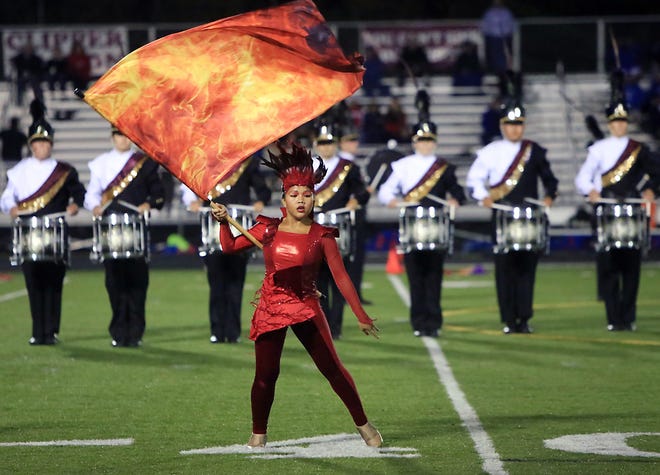 The Portsmouth High School color guard and band perform during halftime at a recent football game.

Ioanna Raptis/Seacoastonline