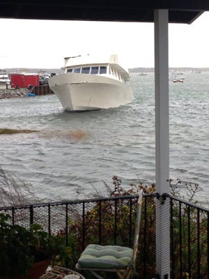 Seventy-foot-long yacht Guest List is shown here still in its beached location along Hampton Harbor despite high water levels during an Oct. 23, 2014, storm. Photo courtesy of Alicia Preston.