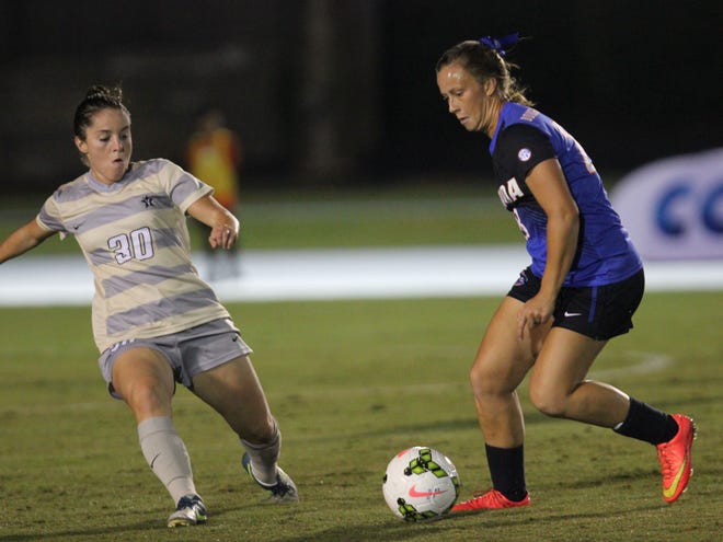 Florida midfielder Meggie Dougherty-Howard keeps the ball away from Vanderbilt midfielder Andie Lakin at Pressly Stadium on Thursday. The Gators beat the Commodores, 6-1.
