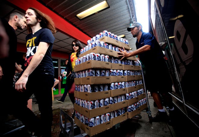 Cases of Pabst Blue Ribbon beer are hauled into the Florida Theater in this file photo from November 2, 2013, before the first show of Fest 12 in Gainesville.