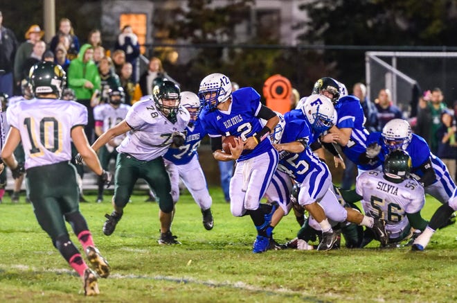 Photos by Ryan Feeney/Advocate

Cameron Charette of the Blue Devils powers through the line to pick up a first down.