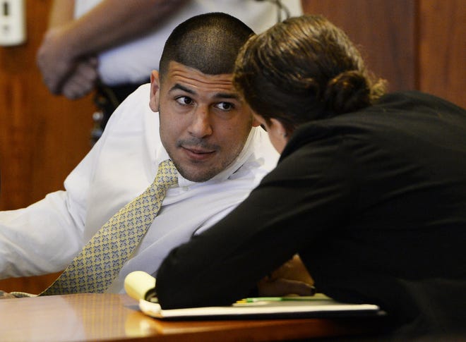 Former New England Patriots NFL football player Aaron Hernandez attends an evidentiary hearing at Bristol County Superior Court, Thursday, Oct. 2, 2014, in Fall River, Mass. Hernandez, 24, has pleaded not guilty to first-degree murder in the 2013 shooting death of Odin Lloyd, a Boston semi-professional football player who was dating the sister of Hernandez's fiancee. (AP Photo/CJ Gunther, Pool) ORG XMIT: NY203