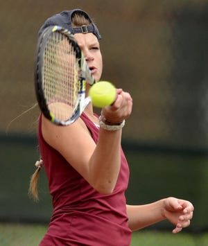 Beaver's Annie Taylor returns a shot in her win over West Allegheny's Carolyn Stout during the MAC tennis tournament on Tuesday, September 16, 2014, at Bradys Run Park.