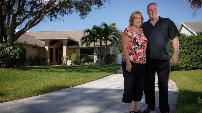 Holly and Ed Kosiec at their home in the Biltmore Terrace neighborhood in unincorporated Palm Beach County. (Thomas Cordy / The Palm Beach Post)