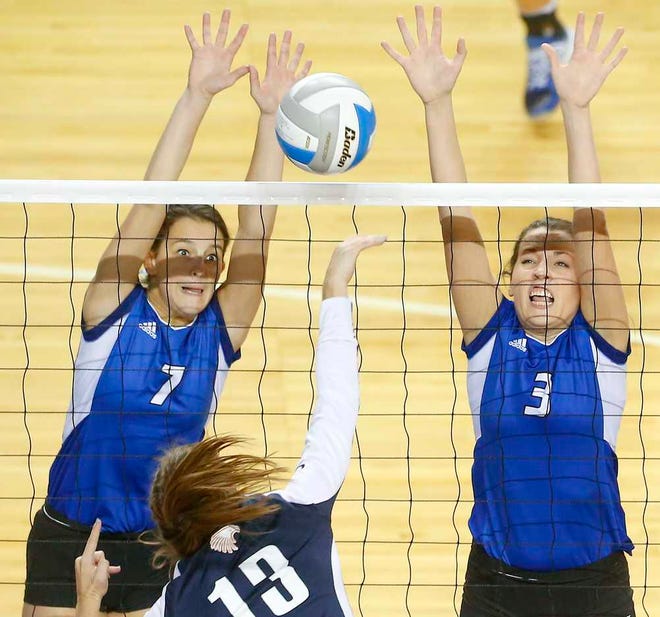Washburn Rural's Jordan Musselman (7) and Morgan Allen (3) try to block a shot by Olathe East's Maggie Jacobson (13) during the semifinal round of the 6A State Volleyball Championship, Saturday morning at the Kansas Expocentre.