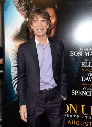 This July 21, 2014, file photo shows musician and producer Mick Jagger at the world premiere of the film “Get On Up” at the Apollo Theater in New York. Mick Jagger is behind another James Brown project, the documentary, “Mr. Dynamite: The Rise of James Brown,” which aired Monday on HBO.