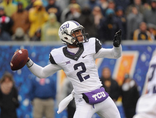 TCU's Trevone Boykin (2) passes during the second quarter of an NCAA college football game against West Virginia in Morgantown, W.Va., Saturday, Nov. 1, 2014. (AP Phpto/Tyler Evert)