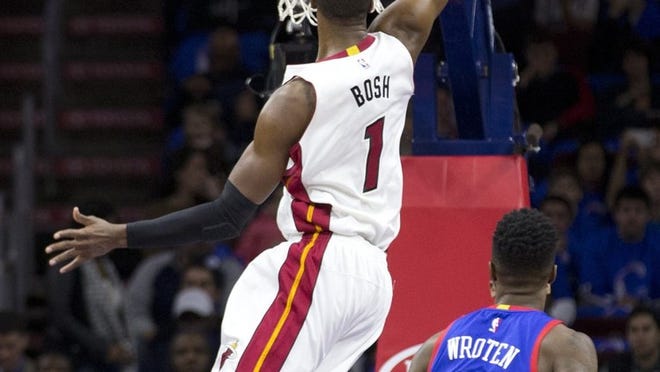 Miami’s Chris Bosh dunks for two of his 30 points during the victory over the 76ers Saturday night in Philadelphia. (Photo by Mitchell Leff/Getty Images)