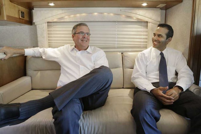LM Otero/The Associated PressFormer Florida Gov. Jeb Bush, left, and his his son George P. Bush smile during an interview on Oct. 14 in Abilene, Texas.