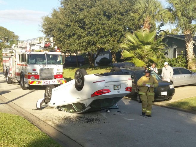 A car rests on its hood Monday morning on Banyan Drive in Ormond Beach. Police said the driver tried to avoid another vehicle near St. Brendan’s Catholic School, overcorrected and ended up rolling over. The driver of the white, four-door Kia was not hurt in the 7:46 a.m. accident, which occurred after children were left off at the school at 1000 Ocean Shore Blvd.