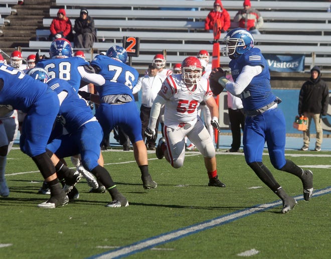 Hillsdale College quarterback C.J. Mifsud rolls out to pass Saturday against Saginaw Valley State. DAVID VANTRESS PHOTO
