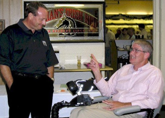 Ken Schrader, whose motorsports resume includes everything from USAC wins to NASCAR Sprint Cup victories, chats with Rod Spalding during a celebrity dinner fundraiser. Spalding has three collectible vehicles, and enjoys "Cars We Remember" on a weekly basis. (Spalding Foundation photo)